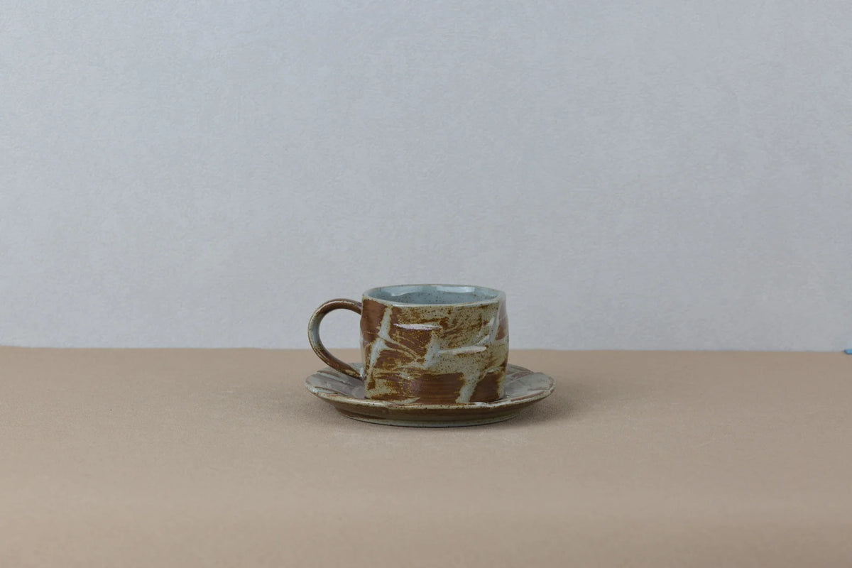 Dusk ceramic cup and saucer in cream, copper and moss green